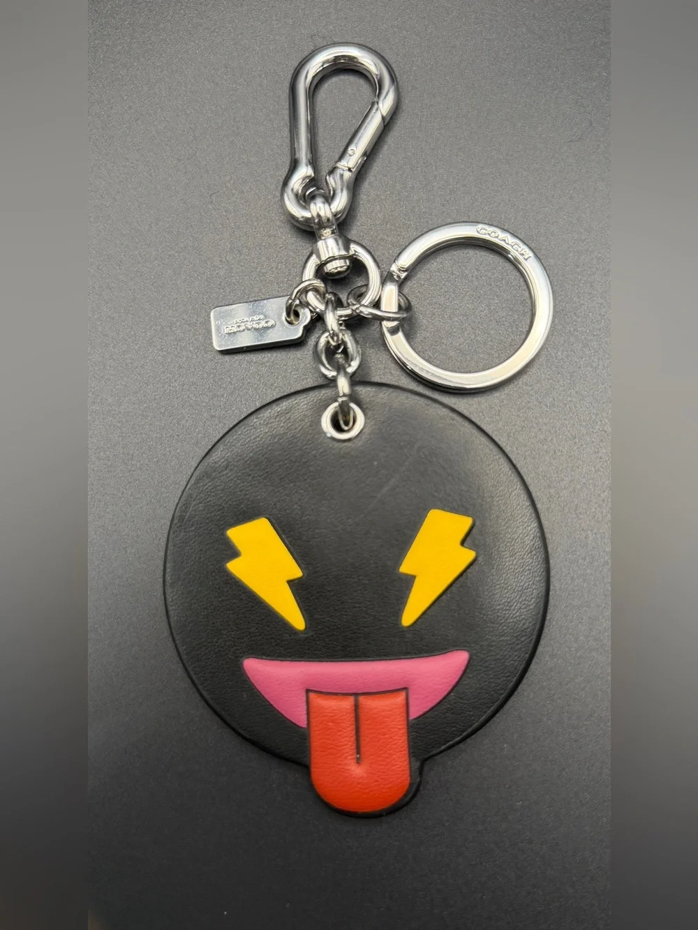 Coach Black Leather Emoji Keychain with Yellow Lightning Eyes & Red Tongue